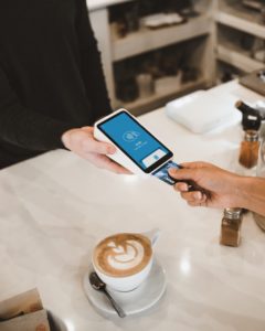 photo of credit card being inserted into credit card reader