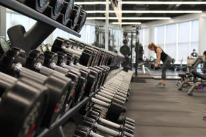 Image of the weight rack at the gym - things to stop buying to save lots of money