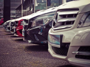 Image of cars on a car lot - things to stop buying to save lots of money