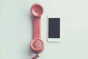 Image of cell phone and telephone 