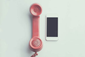 Image of cell phone and telephone 