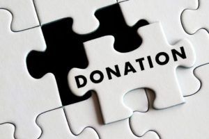 puzzle piece that says donation
