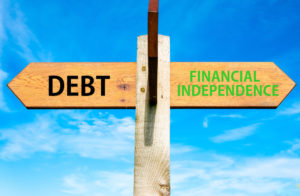road sign with debt and financial independence
