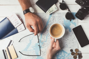 table covered with travel items - what does fi mean