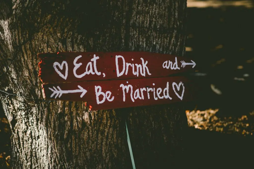 credit card hacking my wedding, sign says eat drink be married